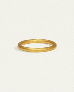 The Tiv Ring is handcrafted from 24k solid gold. Shop minimalist fine jewellery stacking ring with hammered band. Minimalist Hammered Stackable Rings In Recycled Gold, Minimalist Hammered Yellow Gold Rings, Yellow Gold Hammered Stackable Rings, Gold Hammered Stackable Round Band Rings, Gold Hammered Stackable Rings, Classic Hammered Yellow Gold Stackable Rings, Classic Yellow Gold Hammered Stackable Rings, Classic Yellow Gold Stackable Rings With Hammered Detail, Yellow Gold Hammered Midi Rings For Anniversary