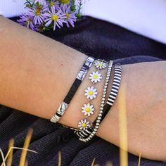 This dainty little daisy bracelet will never tarnish! It's made of stainless steel and enamel, so you can wear it with confidence. You can choose between gold or silver for the base metal color, and there are multiple color options for the flowers. Plus, this bracelet is adjustable, so it should fit almost anyone! Live in it, love it, and wear it proudly knowing it is made with high-quality materials. Spring Friendship Bracelets For Everyday Wear, Spring Everyday Friendship Bracelets, Adjustable Daisy Everyday Jewelry, Trendy Silver Flower Bracelets, Adjustable Daisy Bracelets For Spring, Adjustable Silver Daisy Jewelry, Adjustable Silver Daisy-shaped Jewelry, Trendy Silver Hypoallergenic Friendship Bracelets, Trendy Hypoallergenic Silver Friendship Bracelets