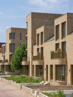 a row of brick apartment buildings next to each other