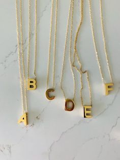 Medium Sized BOLD Initial Necklace | Bold Letter Necklace | Initial Necklace | Alphabet Necklace | Stainless Steel | Stainless Steel InitialHANDMADE-STAINLESS STEEL MEDIUM BOLD LETTER NECKLACE ⁙ Materials: Stainless Steel⁙ Available Colors: Gold & Silver ⁙ Necklace Length: 15"-17.25'' in the length of your choice, chain measures 1.5 mm in width. Anything above 17" will include an extender - Please request your desired size on the notes section. Otherwise a 17.5" with 2" extender will be sent ⁙ P Letter Necklace Initials, Gold Silver Necklace, Alphabet Necklace, Mom Outfit, Necklace Initial, Letter Necklace, Product Photography, Necklace Length, Initial Necklace