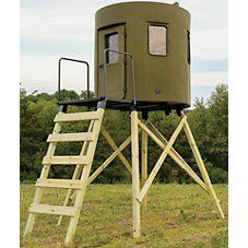 a wooden ladder leading up to a round structure with a window and door on it