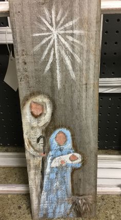 an image of a nativity scene painted on wood