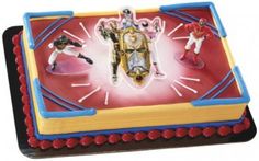 a cake with toy figures on top of it in the shape of a clock face