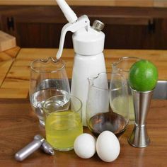 an assortment of glasses and bottles on a table