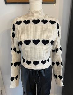 Cozy up in our Sandra Heart Print Mock Neck Sweater! 💖 Embrace the perfect blend of softness and comfort. Whether it's a Valentine's date, a casual day out, daily wear, outdoor adventures, a vacation getaway, or a stylish school look - this sweater has you covered. Stay warm, stylish, and comfortably chic! Wear it tucked in for a polished vibe or keep it long for a laid-back feel. 💕    From Paris - Estee Brown Paris 100% Acrylic  One Size Casual Snug Winter Tops, Trendy Heart Print Sweater For Winter, Warm Casual Tops With Cozy Fit, Casual Warm Tops With Cozy Fit, Warm Cozy Fit Casual Tops, Trendy Fall Sweater With Heart Print, Casual Snug Sweater, Warm Snug Casual Sweater, Casual Warm Snug Sweater