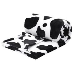 a black and white cow print blanket