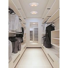 an empty walk in closet with clothes on shelves