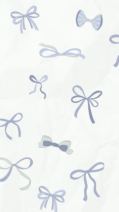 blue and white bows are flying in the air on a sheet of paper that has been drawn