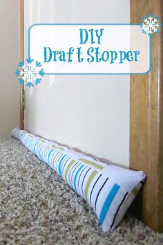 a diy draft stopper sitting on top of a carpeted floor next to a door