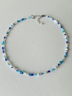 Summer Seed Bead Mixed Blue Necklace! Perfect for the beach, a picnic, boat ride or any sunny day! Get for yourself or a friend as a Summer birthday gift <3 ABOUT    ▢  Size: 15 inches goes up to 17 inches with chain extension. (Can be customized to a smaller or larger size just message me  ▢  Materials: Fishing Line for durability, stainless steel lobster clasp, 2mm / 3mm seed beads  ▢  This item is handmade and may vary slightly from the picture, making every one completely unique.  ▢  Ready t Picnic Boat, Boat Ride, Summer Birthday, Beaded Accessories, Seed Bead Bracelets, Blue Necklace, Beaded Necklaces, Seed Bead, Beading Patterns