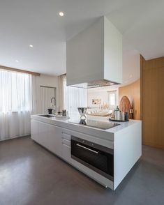 a kitchen with an oven, sink and counter top in it's center island