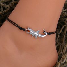 "Silver Alloy Metal Shark Adjustable Bracelet or Anklet. Silky Waxed Cotton Cord with Extension Chain Shark Charm is almost 1-1/4\" or 32mm Long Choice of Cord Color - Black or Blue Bracelet Adjusts from approximately 7\" 18cm up to 10\" 25cm Close up images are not actual size. Please read sizes in description to determine actual size In stock. Shipped daily from Florida USA Our jewelry items, parts, and shark's teeth are not toys and contain small parts, which are not suitable for small childr Merman Kirishima, Shark Charm, Metal Shark, Hippie Bracelets, Black Bracelet, Seashell Necklace, Chain Extenders, Black Bracelets, String Bracelet