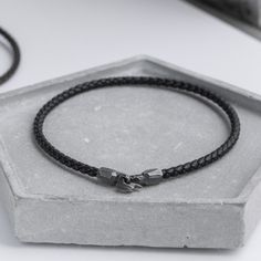 "A simple bracelet made of genuine braided leather cord in black color and a unique oxidized silver hook clasp. The bracelet is unisex, ideal for both men and women and a great choice for a gift for him and her. * Metal: High Quality Sterling Silver 925 * Finish: Black Oxidized * Real Black Leather 3mm diameter 100% nickel free. Delivered in an elegant gift package. S H I P P I N G All orders are shipped via FedEx Express for speed and security (delivery time to the US 3-5 days, Europe 1-2 days) Black Leather Bracelet With Sterling Silver Clasp, Adjustable Black Leather Bracelet With Sterling Silver Clasp, Black Leather Bracelet With Sterling Silver Clasp As Gift, Gift Black Leather Bracelet With Sterling Silver Clasp, Everyday Black Braided Leather Bracelet, Handmade Modern Black Braided Bracelets, Handmade Modern Black Braided Bracelet, Minimalist Black Braided Bracelet With Stainless Steel Clasp, Black Bracelets With Sterling Silver Clasp