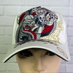 Up For Grabs Is A Brand New Without Tag And With Defect Cliff Raven Artwear Samurai Slaying Dragon White Ed Hardy Tattoo Embroidered Mesh Back Trucker Snapback Hat Cap Adult One Size Fits Most. The Hat Has Discoloration Marks From Improper Store Handling Noted In Photos! Sold As Is! Never Worn Or Used. Please Refer To All Photos. Ask Any Questions Prior To Purchasing. Thanks! Embroidered White Baseball Cap For Streetwear, White Embroidered Baseball Cap For Streetwear, White Embroidered Visor Baseball Cap, White Curved Brim Hat With Embroidery, White Embroidered Hat With Curved Brim, White Embroidered Curved Brim Hat, White Embroidered Trucker Hat With Curved Brim, White Curved Brim Baseball Cap For Festival, White Embroidered Hat With Curved Bill