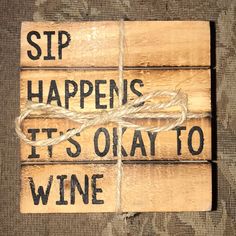 two wooden signs that say sip happens it's okay to wine