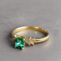 Natural Emerald Diamond Ring - 2 Carat Zambian Emerald ring, 14k Gold Emerald Ring, Unique Designer Emerald Ring, Birthday Gift Ring Emerald GEMSTONE DETAILS : ✦ Gemstone : Natural Zambia Emerald ✦ Gemstone Size : 8 x 10 mm ✦ Gemstone Shape : Emerald Cut ✦ Number of Gemstones : 1 ✦ Gemstone Weight : 2 Carat ✦ Gemstone Grade : Vivid DIAMOND DETAILS : ✦ Diamond Type : Natural ✦ Diamond Size : 1.5 MM ✦ Diamond Color : G-H ✦ Diamond Clarity : Slightly included ✦ Diamond Cut : Excellent ✦ Diamond Wei Gia Certified 14k Gold Cluster Ring, Fine Jewelry Yellow Gold Emerald Promise Ring, Fine Jewelry Yellow Gold Emerald Ring For Promise, Gia Certified Gold Promise Ring, Yellow Gold Gia Certified Diamond Promise Ring, Gia Certified Yellow Gold Diamond Promise Ring, Fine Jewelry Emerald Ring With Vvs Clarity, Gia Certified Yellow Gold Cluster Ring For Anniversary, Gia Certified Yellow Gold Anniversary Cluster Ring