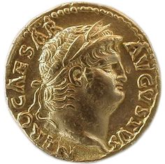 a gold coin with the head of a man