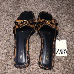 Zara Leopard Print Sandals. Color: Leopard. Size: 7.5. Purchased From Zara. Reasonable Offers Welcomed. Other Ways To Pay Accepted. Smoke Free & Pet Free Household. Brown Flat Heels With Buckle Closure, Chic Brown Sandals With Flat Heel, Chic Brown Flat Heel Sandals, Leopard Print Sandals With Buckle Closure, Chic Open Heel Leopard Print Sandals, Chic Leopard Print Open Heel Sandals, Brown Heels With Buckle Closure For Vacation, Brown Slip-on Heels For Vacation, Trendy Brown Zara Heels