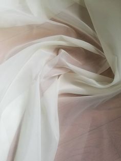 "Organza Chiffon sheer creme color 110 inches wide Usable for drapery and interior Designing .. End user wall hanging, drapery, sheer decorations, etc. Fabric is sold by the yard - to order, select the desired quantity of yards from the drop-down list, each yard will show in your shopping cart as an item but they will ship as one continuous piece Width : 110\" inches Color : Creme Thank you for your coming! Please read policy before placing an order. Please contact us via ETSY Conversations for Silk Chiffon Fabric, Cream Aesthetic, Creme Color, 背景 シンプル, Fabric Suppliers, White Chiffon, Silver Mirror, Organza Fabric, Gowns Of Elegance