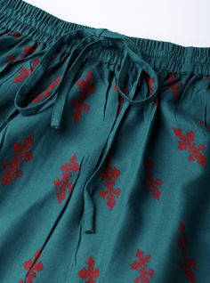 Look trendy and feminine by wearing this skirt for women from VitansEthnics. Made from premium fabric, this skirt has a very catchy design. Teal blue and red printed mid-rise flared maxi skirt with gathered detail, has an elasticated waistband with a drawstring fastening, flared hem.Material: 100% RayonSizes: To Fit Waist(in inches): 26, 28, 30, 32, 34, 36Skirt Length: 40inchesLining: No LiningPattern: PrintedStyle: Lehenga Skirt For Women, Maxi Skirt, Pure Cotton SkirtWash Care: Machine WashDis Flowy Long Skirt For Festive Occasions, Festive Flowy Skirt, Festive Flowy Long Skirt, Festive Long Flowy Skirt, Traditional Pleated Skirt, Flare Maxi Skirt, Indian Skirt, Lehenga Skirt, Skirt For Women