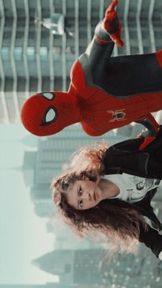 the amazing spider - man and woman are flying through the air