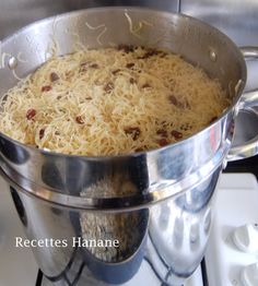 a large metal pot filled with food on top of a stove