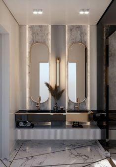 a bathroom with two sinks and mirrors on the wall