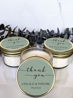 three small candles with thank you labels on them