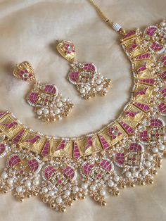 R O S H   J E W E L R Y Welcome to Rosh! Meet the perfect bridal necklace, handmade and attentively created in India!    This Tyaani Inspired necklace is an amazing amalgamation of pastels to amp up your colorful outfit.  Pair it  up with your best lehnga saree outfit and spread magic! If you're a bride-to-be looking to add some very artistic and unique jewelry to your bridal couture, then we have got you covered, and how?! This sits beautifully as a bridal necklace with intrinsic Kundan work co Pink Kundan Jewelry Sets With Stone Work, India Jewelry Gold, Pink Kundan Jewelry Sets, Pink Bollywood Style Kundan Necklace, Gold Kundan Choker, Pink Bollywood Kundan Necklace, Elegant Pink Meenakari Jewelry Sets, Jadau Necklace Set, Saree Outfit