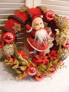 a christmas wreath with a santa clause on it