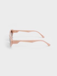 Put the perfect finishing touch on a chic, feminine look with these acetate oval sunglasses. Simple yet stylish for maximum versatility, they feature tinted oval lenses and a geometric design along the temples. In sweet pink, this charming accessory is perfect for adding a pop of colour to any outfit. Slot these beauties into the accompanying protective case when you are not wearing them. Charles Keith, Oval Sunglasses, Sunglasses & Glasses, Feminine Look, Geometric Design, Protective Cases, Color Pop, Lenses, Product Launch