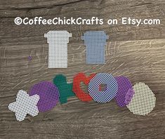 cross stitched letters spelling out the word love on a wooden background with text coffee chick crafts on etsy com