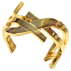 Collectible Saint Laurent YSL Gold Tone YSL Wrap Around Heavy Bracelet Cuff. Opening in back is 1.85" Rigid Cuff. I think this bracelet cuff speaks for itself with the YSL. Don't you? This should fit 7" to 8.5" Ysl Cuff Bracelet, Ysl Gold, Double Wrap Bracelet, Gold Bracelet Cuff, November 23, Saint Laurent Paris, Bracelet Cuff, Hair Jewelry, Wrap Around