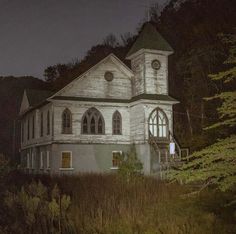 an old church in the woods at night