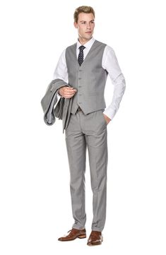 Bring understated elegance to the table in this three-piece suit crafted from rich fabric in a classic single-breasted silhouette. Jacket has notched lapels; chest welt pocket; front flap pockets Vest has front button closure; V-neck Pants have zip fly with button closure; front slant pockets; back button-welt pockets Jacket and vest are lined; trousers are lined to the knee 65% polyester, 35% viscose Dry clean Imported Each suit has a 6” drop, meaning that a size 38R jacket is paired with size Single Breasted Lapel Collar Business Sets, Business Sets With Single Breasted Lapel Collar, Elegant Three-piece Suit In Suiting Fabric For Office, Single Breasted Suiting Fabric Sets For Business Casual, Business Casual Single Breasted Suit Sets, Single Breasted Business Casual Suiting Sets, Business Casual Single-breasted Suit Set, Professional Single Breasted Suiting Fabric Sets, Professional Slim Fit Business Casual Sets