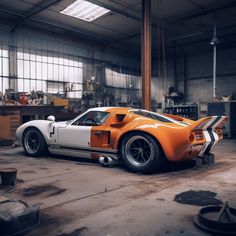 an orange and white sports car in a garage