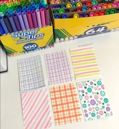 some crayons and markers on a table