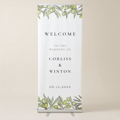 a welcome sign with olives and leaves on it for a wedding or bridal party