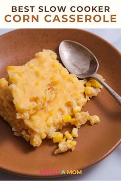 the best slow cooker corn casserole recipe on a plate with a spoon