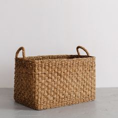 a woven basket sitting on top of a table