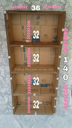 three cardboard shelves with numbers on each shelf