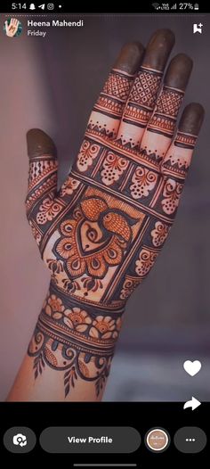 the hand is decorated with henna designs