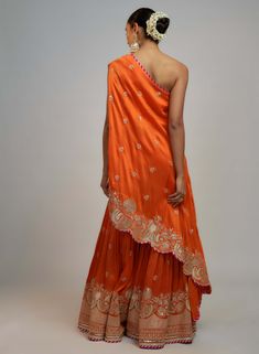 Editor's Note This stylish indo-western set blends bold femininity with a smart, one-shoulder top paired with sharara featuring delicate gold embroidery. Tailored for events, providing the versatility to flow seamlessly with your movements and leave a lasting impression. Orange Sharara, Western Hairstyles, Anarkali Lehenga Gowns, Mehendi Outfit, Anarkali Lehenga, Celebrity Closet, Suits Design, Bride Accessories, Sharara Set