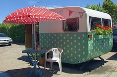 an old camper converted into a mobile home with polka dots on the roof and side walls