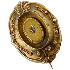 This gorgeous victorian brooch holds a rose cut diamond at the centre and is modelled in 18carat gold. The back of the locket has a pane of glass which created a locket. There is a pin on the back and also a loop so you can wear as a pendant. Brooch Dimensions: 25x35mm Weight: 7g Victorian Gold Brooch With Locket, Victorian Gold Locket Brooches, Antique Rose Cut Diamonds Brooch For Formal Occasions, Antique Gold Brooches With Rose Cut Diamonds, Ornate Gold Brooch With Rose Cut Diamonds, Ornate Gold Brooches With Rose Cut Diamonds, Ornate Locket Brooch For Formal Occasions, Victorian Gold Brooch With Screw Back, Vintage Yellow Gold Brooches With Rose Cut Diamonds