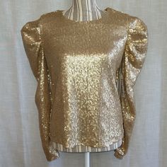 Gold Sequin Long Sleeve Top Blouse Brand: Calligraphie Size: Small Color: Gold Sequin Fabric Long Sleeve Puffed Balloon Sleeve All Lined Round/Crew Neck Keyhole With Button Closure Pullover New With Tags Please See All Pictures For Details Fall Party Padded Blouse Top, Padded Blouse For Fall Party, Long Sleeve Sequin Top For Celebration, Glamorous Long Sleeve Tops For Celebration, Glamorous Padded Blouse For Spring, Party Puff Sleeve Top With Long Sleeves, Spring Long Sleeve Puff Sleeve Top For Party, Glamorous Padded Blouse Tops For Fall, Puff Sleeve Padded Blouse For Evening