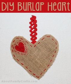 a burlap heart with red thread hanging from it's side and the words diy burlap heart on top