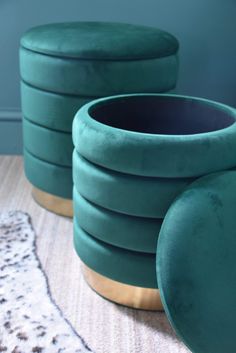 three green round stools sitting on top of a rug