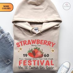 🍓🎨 Step into a world of vintage charm and festival vibes with our Vintage Watercolor Strawberry Festival Hoodie. This hoodie isn't just an article of clothing; it's a fusion of nostalgic art, festival spirit, and cozy comfort. 🎡 We have meticulously created a captivating vintage-style watercolor strawberry festival design. The result? A stunning blend of yesteryear's beauty and artistic flair, all adorning a comfortable and stylish hoodie. 🧥 Crafted from premium materials, this hoodie offers the perfect balance of softness and durability. The relaxed fit ensures both comfort and style, making it an ideal choice for laid-back outings, casual gatherings, or simply embracing the festive spirit. 🌼 The vintage watercolor strawberry festival artwork transports you to a time when celebration Vintage Cotton Hoodie With Letter Print, Vintage Hooded Hoodie For Spring, Retro Hooded Sweatshirt For Fall, Retro Hoodie With Drawstring Hood For Fall, Vintage Long Sleeve Hoodie For Spring, Retro Cotton Hoodie For Spring, Vintage Hoodie For Spring Streetwear, Retro Hoodie With Letter Print For Fall, Vintage Streetwear Hoodie For Spring