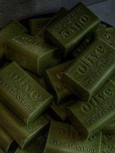 a pile of olive oil soap bars sitting on top of each other